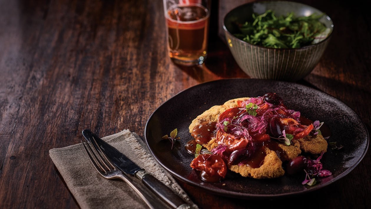 Lamb Leg Schnitzel, Char Grilled Tomato, Olives, Onion Jam Gravy – Recipe